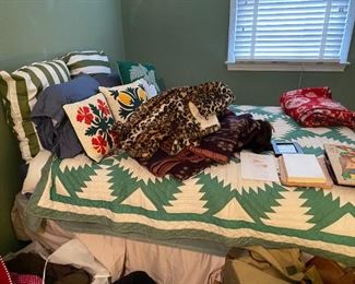 Large selection of pillows and bedding.