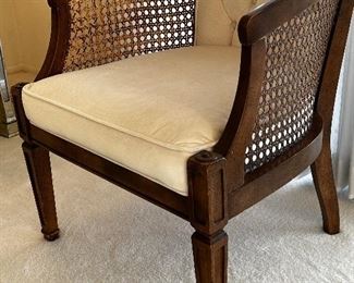 Pair of upholstered cane chairs