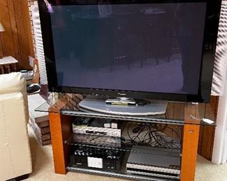 Pioneer flat screen TV on a nice glass and wood pedestal