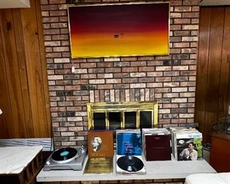 Records on the fireplace hearth