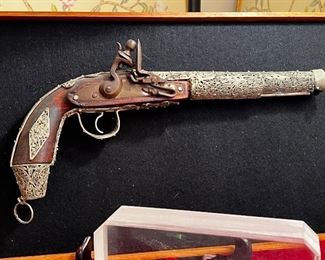 Spectacular 18th century flintlock pistol with silver wire filigree