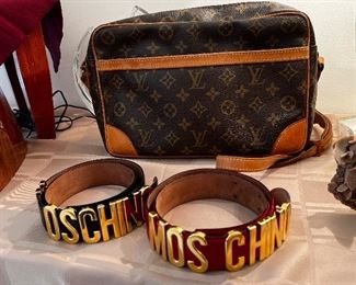Ladies black and red Moschino belts and Louis Vuitton Crossbody, camera bag