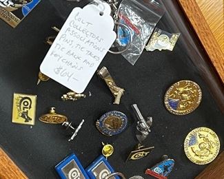 Colt collectors association’s pens, tie tacks, tie back and keychains