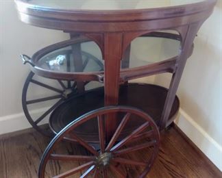 Vintage rolling serving cart. Perfect for a home bar!  Wheel needs some work. 32" x 19" oval top. 31" height 