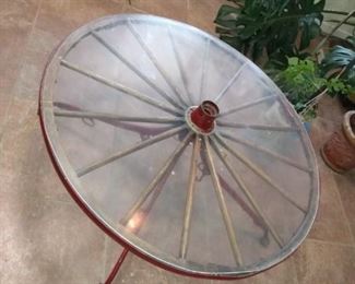 Antique Wagon Wheel crafted into a coffee table. 44" diameter top, 18.5" height 