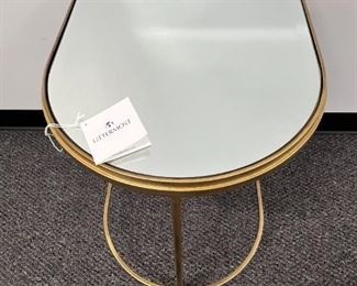 $100  Uttermost Hand Forged Demilune Mirror Top Gold Side Table MTF153-8                                   Description: This gorgeous end table is elegantly curved with hand forged iron frame, finished in antique brushed gold with beveled mirror top
Dimensions: 18 x19 x 24
Condition: New out of box. 
Location: Local pick up Portland, OR.  Shipper suggestions available upon request.  Item is in a warehouse with easy bay door access.