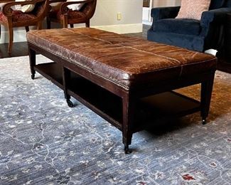 $250   Michael Weiss Leather Top Brown Ottoman Coffee Table Bench LP162-3                               
Description:  A large scale, good looking and useful size brown tufted leather ottoman with brass nail head trim on the skirt. Raised on brown tapered column legs on brass casters. 

Dimensions: 59 x 26 x 18 in

Condition: Please see all detail photos. There is some wear at the connection of the legs to the lower shelf of the Ottoman and expected wear in an even patina overall, slight scrapes to the legs with one area that has had puppy damage.

Location: Local pick up Portland, OR 97068.  Shipper suggestions available upon request.
