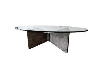 $1000 Kravet Oval Glass Top Oval Coffee Table  MTF153-13  DESCRIPTION:  Kravet's large oval cocktail/coffee table with substantial cross base in a grey painted wood with 3/4 inch oval glass top. This clean, simple look with sculptural angles beautifully complements other decor while standing out as functional art. Well made table constructed with extraordinary care. Kravet is a century old, family-owned home furnishings business known for its superb craftsmanship and attention to detail.

Dimensions: 60 x 32 x 18.5 H in.  |  3/4 in thick glass top

Condition: New.  The piece was an interior design custom order. The glass top has an internal chip incurred during shipping.  The outside suffers no cracking or chipping and is as smooth to the touch as new glass.  Glass top is easily replaceable.

Location: Local pick up Portland, OR.  Shipping suggestions available upon request. 
