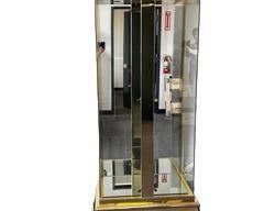 $2750 USD      Mastercraft Brass and Glass Display Cabinet MTF153-18     Description: Mastercraft was one of a handful of 20th century American furniture companies that produced beautifully designed and excellently crafted pieces. Mastercraft's founder William Doezema often employed well-known artisans such as John Widdicomb and Bernard Rohne to design for the Mastercraft label. Mastercraft, known for their artistic design, often used exotic woods and brass detailing. Offered is a Mastercraft display cabinet with highly polished lacquered brass and glass doors, along with 3 glass shelves and interior lighting. The Mastercraft cabinet of this design is quite rare.

Dimensions: 37.5W x 22.25D x 82H in

Condition: Used in excellent condition. There is one very minor indent on the left side lower base. Please see photo's for detail.

Location: Local pick up main floor warehouse storage.  Portland, OR. Shipper suggestions available upon request.       https://goodbyhello.com/products/copy-o