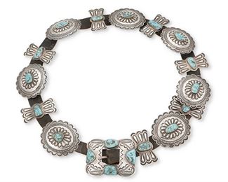 2
Mid/late 20th century; Dine
A Navajo Concho Belt
Appears unmarked
Comprising seven silver oval conchos with set turquoise and seven silver butterfly conchos with set turquoise as well as a matching buckle, all set to a black leather strap
Buckle: 2.5" H x 3.125" W; each oval concho: 2.5" H x 2.75" W; each butterfly: 2.375" H x 1.125" W; belt: 0.75" H x 35.5" L<br />475.3 grams gross
Estimate: $1,000 - $1,500