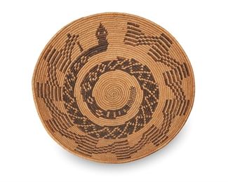 13
Early 20th century; Southern California
A Polychrome California Mission Pictorial Basket
A wide coiled basket with rattlesnake motif to center
3.375" H x 13.5" Dia.
Estimate: $5,000 - $7,000