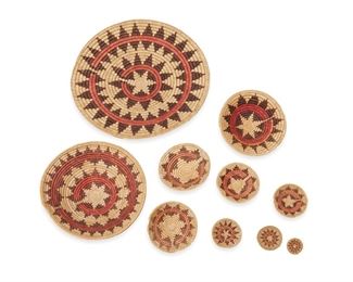 32
Late 20th century; Dine
A Collection Of Ten Polychrome Navajo Wedding Tray Baskets
A large group of coiled basket trays woven in red, black, and natural fibers in various banded star and zigzag motifs in graduated sizes, 10 pieces
Largest: 28.75" Dia.; smallest: 2.5" Dia.
Estimate: $500 - $700