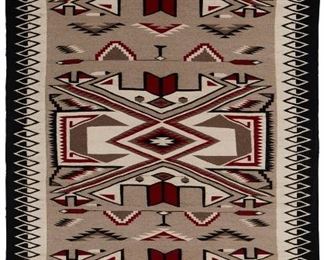 35
Mid/late 20th century; Dine
A Large Framed Navajo Teec Nos Pos Rug
Woven in red, cream, grey, and black wool with three elaborate X-motif (possibly waterbug) all within a black and white diamond border professionally framed under plexiglass and mounted to a cream linen backing
108" H x 65" W approximately
Estimate: $3,000 - $5,000