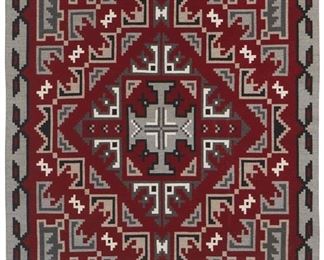36
Mid/late 20th century; Dine
A Large Framed Navajo Ganado Rug
Woven in red, cream, dark grey, light grey, and black wool with a central diamond and radiating elements finished with an elaborate border, professionally framed and mounted to cream linen within a custom plexiglass frame
83" H x 59.5" W approximately
Estimate: $2,000 - $3,000
