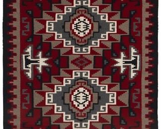 38
Mid/late 20th century; Dine
A Framed Navajo Ganado Rug
Woven in red, cream, light grey, dark grey, and black wool with two central diamonds and a stepped border professionally framed and float-mounted within a shadowbox plexiglass frame
71" H x 50.5" W approximately
Estimate: $800 - $1,200