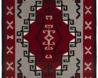 39
Mid/late 20th century; Dine
A Framed Navajo Ganado Rug
Woven in red, cream, light grey, and black wool with a stepped and hooked central diamond and X-motif to border, professionally framed and mounted to cream linen within a plexiglass frame
73" H x 54" W approximately
Estimate: $600 - $900