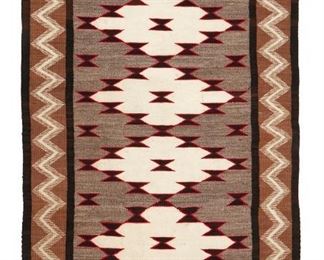 47
Mid-20th century; Dine
A Navajo Regional Rug
Woven in dark brown, grey-brown, tan, cream, and red wool with six diamonds in center and zig-zag borders
50" H x 31.5" W
Estimate: $300 - $500