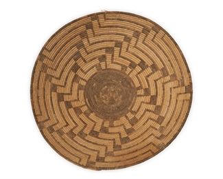 51
Early/mid-20th century; Akimel O'odham, Southwest United States
A Pima Basket Bowl
A large coiled bowl with a central black base and radiating hooked swirl motif
6" H x 17" Dia.
Estimate: $400 - $600