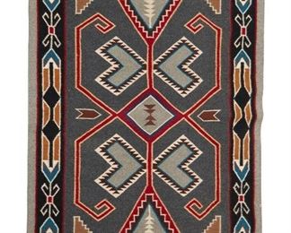 56
Mid/late 20th century; Dine
A Navajo Teec Nos Pos Saddle Blanket
Woven in dark grey, cream, red, blue, ochre, brown, and black wool with a stylized waterbug to center and a stylized black border
49" H x 36.5" W
Estimate: $400 - $600