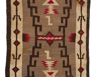 59
Mid-20th century; Dine
A Navajo Regional Rug
Woven in cream, red, grey, and dark brown wool with a stylized storm pattern motif and border
72" H x 44" W
Estimate: $300 - $500