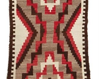 62
Mid-20th century
A Navajo Regional Rug
Woven in brown, cream, red, and grey-brown wool with a central X motif and stepped border to two sides
62" H x36" W
Estimate: $300 - $500