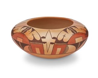 96
Jean Sahmie, Tobacco Flower Girl (B. 1948, Hopi-Tewa)
A polychrome pottery bowl, circa 2000
Signed to underside with artist's corn cipher and looped symbol
The bowl with polychrome avian motif on burnished buff slip glaze
4.25" H x 9.25" Dia.
Estimate: $400 - $600