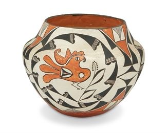 93
20th century; Acoma Pueblo, New Mexico
An Acoma Pottery Olla
The large polychrome pottery vessel with three geometric panels centering a parrot on a buff ground
7.75" H x 9.25" Dia.
Estimate: $1,000 - $2,000