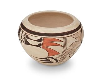 98
Joy Navasie, Second Frog Woman (1919-2012, Hopi-Tewa)
A polychrome pottery bowl, late 20th century
Signed to underside with artist's frog cipher
The bowl with polychrome avian motif on burnished white slip glaze
4" H x 5.5" Dia.
Estimate: $200 - $400