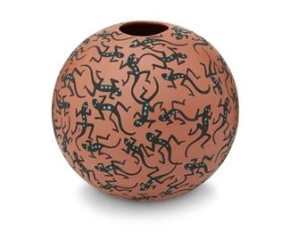 101
20th century
A Large Acoma Lizard Bowl
Signed to underside: Acoma / LC [possibly for Lorianne Concho]
The large polychrome vessel with red slip glaze with an all over lizard motif
10.5" H x 10.5" Dia.
Estimate: $200 - $400

