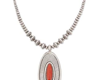 105
Late 20th/21st century
Gibson Nez (D. 2007; Dine/Jicarilla Apache)
Stamped: GZN / Navajo
A large Navajo silver pendant with oval coral cabochon set on a silver bead necklace
20" L x 4" H<br />185.1 grams gross
Estimate: $2,000 - $3,000