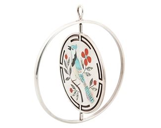 108
Late 20th century
Dennis Edaakie (1931-2008; Zuni)
A Zuni inlay silver spinner pendant
Stamped: Dennis E.
Comprising a large two-sided spinner pendant with inlaid turquoise, coral, mother of pearl, abalone, and onyx depicting a cardinal and blue jay with foliate and floral motifs
3.25" H x 2.75" Dia.<br />54.4 grams gross
Estimate: $500 - $700
