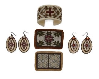 111
Late 20th/21st century
Marguerite Houle (B. 20th Century, Huron/Metis)
A group of five beadwork items including a beaded cuff lined with suede (6.75" total inner C x 1.625"; wrist opening: 1"), two beaded belt buckles lined with suede (2.5" H x 3.625" W and 2.625" H x 3.625" W) and two pairs of earrings worked in seed beads, porcupine quills and horsehair (each marked: MH; each 2.125" H), 7 pieces
Estimate: $100 - $200