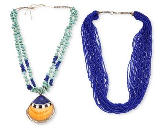 115
Mid/late 20th century
Two Southwest Style Necklaces
Two works:

A Kenneth Aguilar Santo Domingo Pueblo-style necklace
(b. 20th century, Kewa)
A large sterling silver set shell pendant with mosaic lapis overlay mounted on a double strand turquoise and lapis stone necklace
Shell stamped: K A / Sterling
26" L x 3" H x 2.75" W

A multistrand blue glass bead necklace with cone tips
30" L

2 pieces
Shell necklace: 137.1 grams gross
Estimate: $300 - $500
