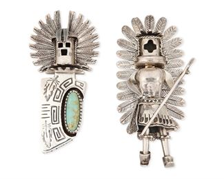 147
Late 20th Century
Two Southwest-Style Katsina Pendant Brooches
Two works:

A Carol Felley turquoise set masked kachina pendant/brooch
Stamped for Carol Felley; further stamped: Sterling / 88
3" H x 1.5" W

A sterling silver pendant of a full figure articulated katsina dancer
Stamped: AV / Sterling
3.25" H x 1. 5" W

2 pieces
100.8 grams gross
Estimate: $200 - $400