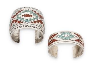 160
Mid/late 20th century
Two Southwest Santo Domingo Style Cuff Bracelets
Each stamped with unknown arrowhead mark with circle within
One wide cuff (7.25" total inner C x 2.125" H, with a 1.125" gap), and one narrow cuff (7" total inner C x 1" H, with a 1.125" gap), each with turquoise and coral chip inlay in geometric textile motifs, 2 pieces
181.9 grams gross
Estimate: $300 - $500