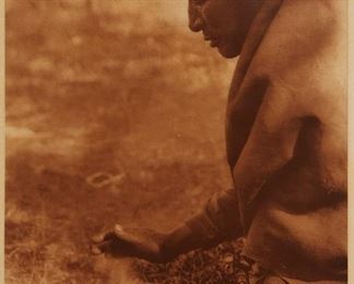 175
Edward S. Curtis
1868-1952
"Kindling Fire - Assiniboin," Plate 631 From "The North American Indian" Volume 18
Photogravure in brown on tissue-thin Japanese paper
From the Suffolk Engraving Co., Cambridge MA edition printed after the 1926 original photograph copyrighted by Curtis; with the title, plate number, copyright, publisher, and artist name all printed in the blank outside the image
Image: 15.625" H x 11.625" W; Sheet: 17.5" H x 12.875" W
Estimate: $500 - $700