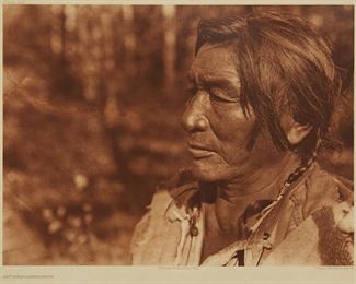 176
Edward S. Curtis
1868-1952
"Agichida - Assiniboin," Plate 635 From "The North American Indian" Volume 18
Photogravure in brown on tissue-thin Japanese paper
From the Suffolk Engraving Co., Cambridge MA edition printed after the 1926 original photograph copyrighted by Curtis; with the title, plate number, copyright, publisher, and artist name all printed in the blank outside the image
Image: 11.75" H x 15.625" W; Sheet: 13.5" H x 16.75" W
Estimate: $500 - $700