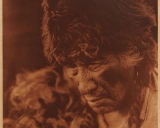 178
Edward S. Curtis
1868-1952
"Oksoyapiw - Blackfoot," Plate 639 From "The North American Indian" Volume 18
Photogravure in brown on tissue-thin Japanese paper
From the Suffolk Engraving Co., Cambridge MA edition printed after the 1926 original photograph copyrighted by Curtis; with the title, plate number, copyright, publisher, and artist name all printed in the blank outside the image
Image: 15.625" H x 11.625" W; Sheet: 17.5" H x 13" W
Estimate: $300 - $500