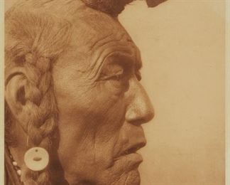 179
Edward S. Curtis
1868-1952
"Bear Bull - Blackfoot," Plate 639 From "The North American Indian" Volume 18
Photogravure in brown on tissue-thin Japanese paper
From the Suffolk Engraving Co., Cambridge MA edition printed after the 1926 original photograph copyrighted by Curtis; with the title, plate number, copyright, publisher, and artist name all printed in the blank outside the image
Plate: 15.375" H x 11.375" W; Sheet: 17.125" H x 12.5" W
Estimate: $1,000 - $1,500