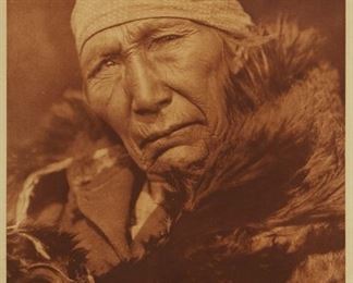 197
Edward S. Curtis
1868-1952
"Soyaksin - Blood," Plate 651 From "The North American Indian" Volume 18
Photogravure in brown on tissue-thin Japanese paper
From the Suffolk Engraving Co., Cambridge MA edition printed after the 1926 original photograph copyrighted by Curtis; with the title, plate number, copyright, publisher, and artist name all printed in the blank outside the image
Image: 15.875" H x 11.625" W; Sheet: 17.625" H x 12.375" W
Estimate: $200 - $300