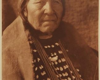 198
Edward S. Curtis
1868-1952
"Stsimaki" ("Reluctant-To-Be-Woman") - Blood," Plate 650 From "The North American Indian" Volume 18
Photogravure in brown on tissue-thin Japanese paper
From the Suffolk Engraving Co., Cambridge MA edition printed after the 1926 original photograph copyrighted by Curtis; with the title, plate number, copyright, publisher, and artist name all printed in the blank outside the image
Image: 15.625" H x 11.625" W; Sheet: 17.5" H x 12.75" W
Estimate: $200 - $300