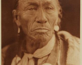 199
Edward S. Curtis
1868-1952
"Muwu ("His Tooth") - Sarsi," Plate 619 From "The North American Indian" Volume 18
Photogravure in brown on tissue-thin Japanese paper
From the Suffolk Engraving Co., Cambridge MA edition printed after the 1926 original photograph copyrighted by Curtis; with the title, plate number, copyright, publisher, and artist name all printed in the blank outside the image
Image: 15.375" H x 11.375" W; Sheet: 17.25" H x 12.625" W
Estimate: $700 - $900