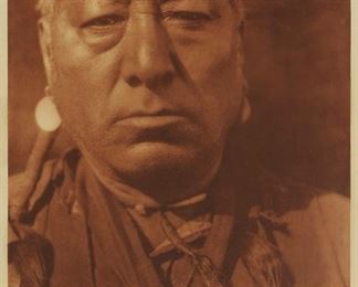 200
Edward S. Curtis
1868-1952
"Astanihkyi "Come-Singing" - Blood," Plate 649 From "The North American Indian" Volume 18
Photogravure in brown on tissue-thin Japanese paper
From the Suffolk Engraving Co., Cambridge MA edition printed after the 1926 original photograph copyrighted by Curtis; with the title, plate number, copyright, publisher, and artist name all printed in the blank outside the image
Image: 15.25" H x 11.625" W; Sheet: 17" H x 12.75" W
Estimate: $200 - $300