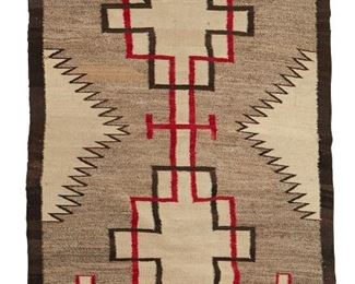 206
Mid-20th century; Dine
A Navajo Regional Rug
Woven in red, cream, dark brown, and grey wool with conjoined stepped motifs
65" H x 40" W
Estimate: $200 - $400
