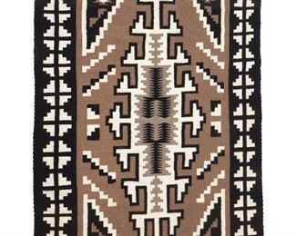 208
Mid/late 20th century
A Navajo Two Grey Hills Rug
Woven in black, grey, and cream wool with a central hooked stepped diamond and geometric border
77.5" H x 49" W
Estimate: $500 - $700