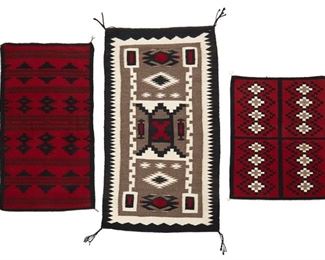 217
Mid/late 20th century; Dine
A Group Of Navajo Mats
Three works comprising a small rug woven in grey, cream, red and black wool in a stylized storm pattern with waterbug motifs (52" H x 28" W), a narrow manta-style mat woven in red and black wool with striped and diamond banding (42.5" H x 23" W), and a Ganado style mat woven in red, cream and black wool with two columns of stacked cream diamonds (31" H x 24.% " W), 3 pieces
Estimate: $500 - $700