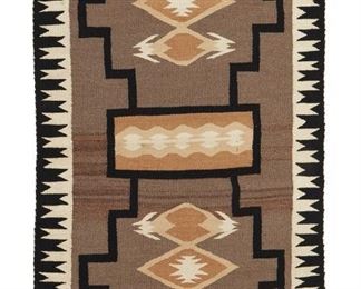 219
Mid/late 20th century
A Navajo Storm Pattern Variant Rug
Woven in black, cream, mustard, and natural grey wool with central X motif, waterbug diamond motifs and a stepped serrated border
58.5" H x 37" W
Estimate: $500 - $700