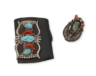 222
Mid/late 20th century
Two Southwest Silver Jewelry Items
Ring etched: G 77
Comprising a ketoh arm guard with turquoise and coral set to sandcast silver, mounted to a black leather band (Silver: 3.75" H x 2.5" W; band: 4.75" H x 10.25" W) and a large turquoise and coral silver ring with ornate foliate motifs (Ring size: 12 [adjustable]), 2 pieces
174.3 grams gross
Estimate: $600 - $900