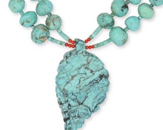 223
Early/mid-20th century
A Leekya-Style Zuni Carved Turquoise Necklace
A Zuni-style carved turquoise leaf form pendant suspended by a double strand of faceted turquoise beads
30" L x 3.25" H
Estimate: $700 - $900
