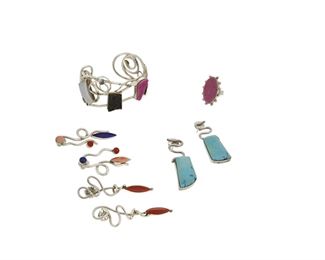 228
21st century
Veronica Poblano (B. 1951, Zuni)
A mixed group of stone set and silver wire jewelry
Each stamped: Veronica
Comprising an abstract silver wire cuff with four druzy quartz stones in various colors (7" total inner C x 1.5" H, including a 1" gap), an oval pink druzy quartz ring (Ring size: 7.25; 1" H), and three pairs of abstract stone set earrings, including a pair with set turquoise (2.25" H), 8 pieces
119.0 grams gross
Estimate: $800 - $1,200